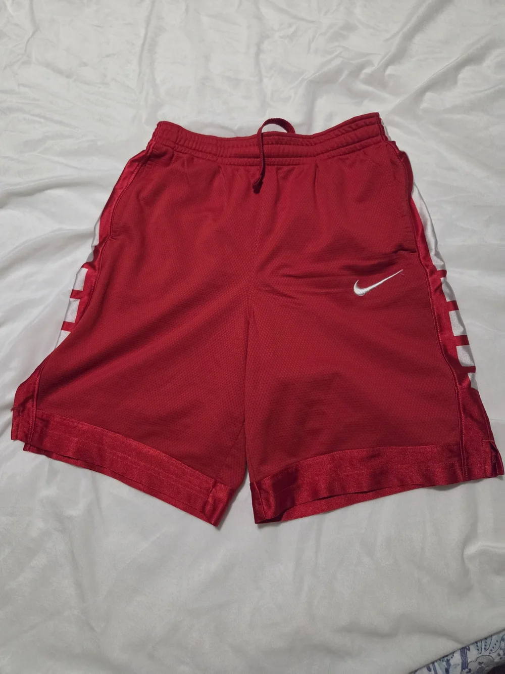 Nike Red Mesh Athletic Shorts with White Swoosh and Side Panels